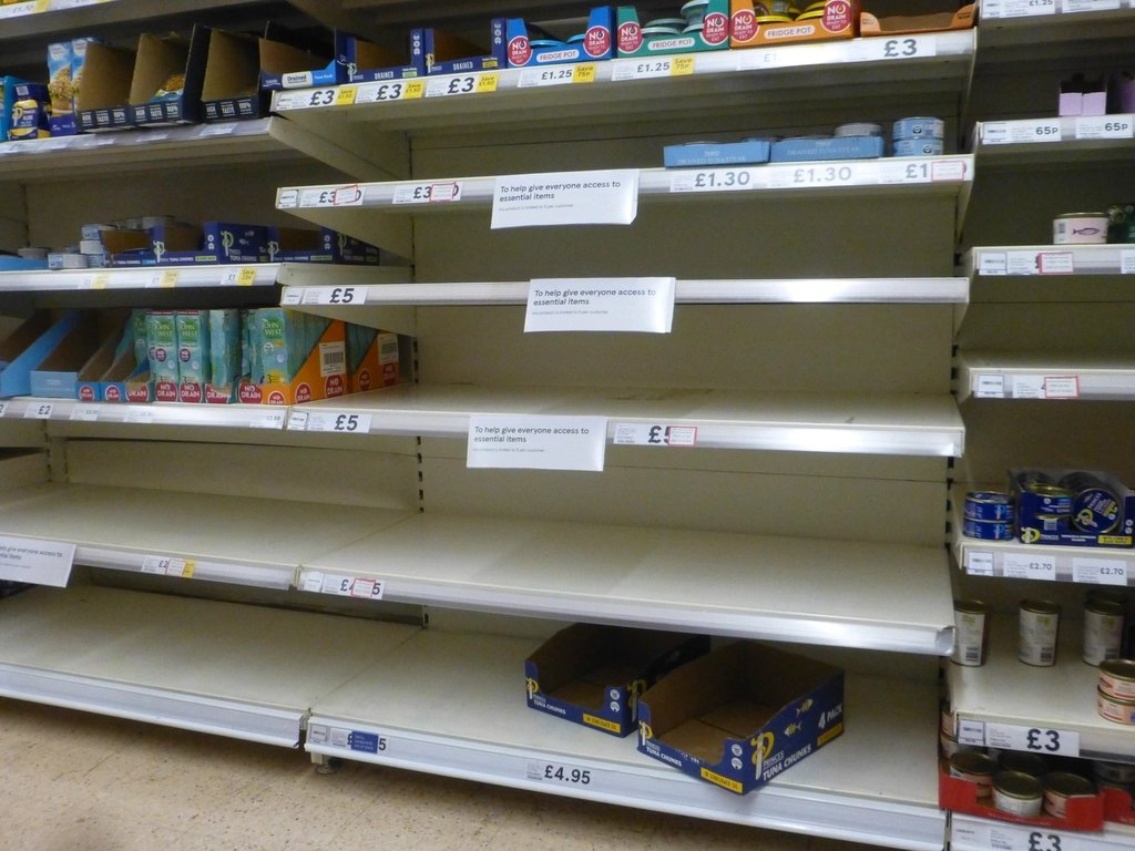 Empty shelves plus signs that